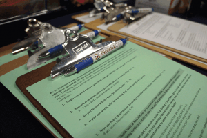 Clipboard with survey questionnaires