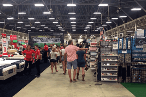 People walking around inside the expo hall at the Indiana state fairgrounds